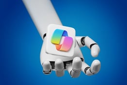 Robot hand offering Copilot logo