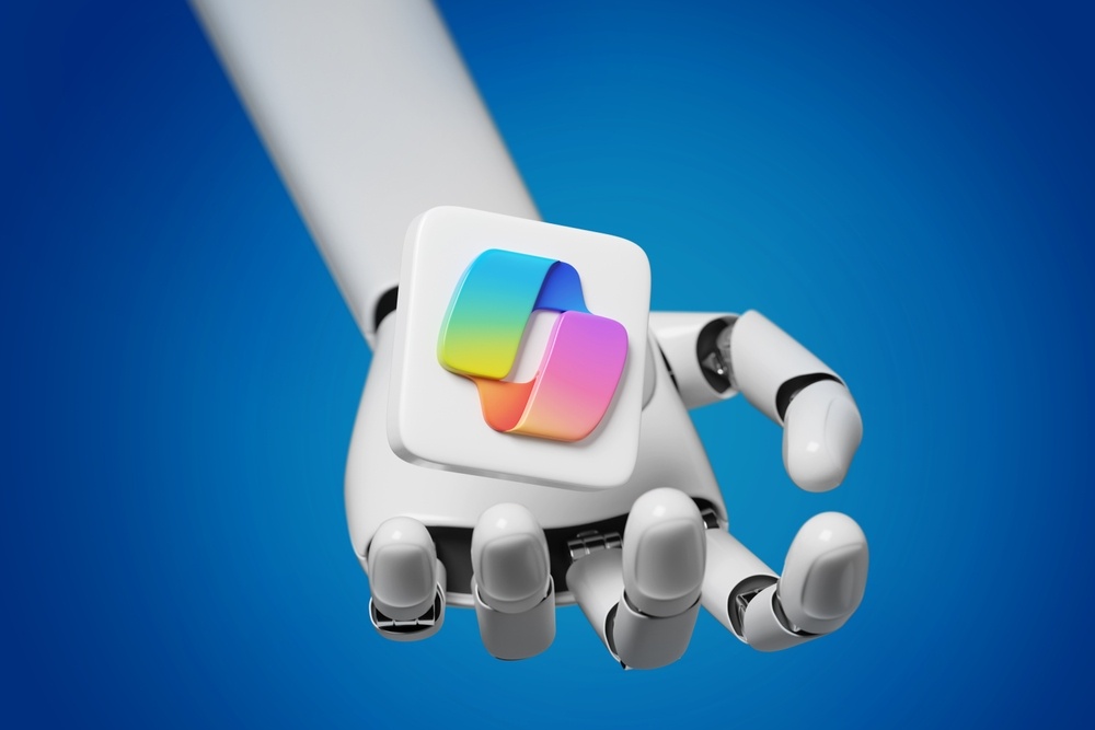 Robot hand offering Copilot logo